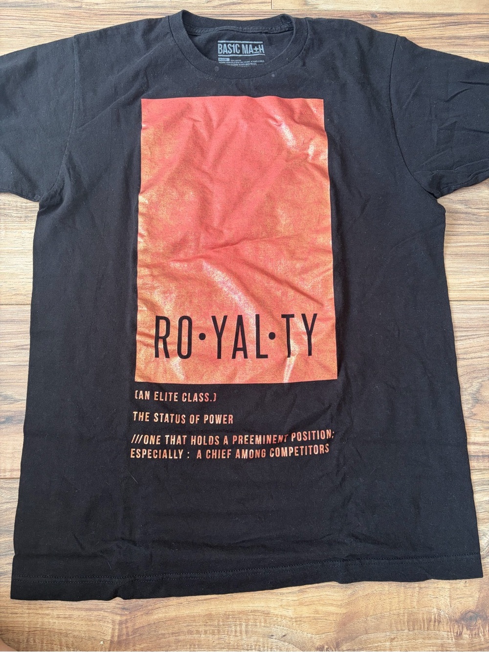Hot Topic Black Short-Sleeve Tee with Orange Graphic 'RO·YAL·TY'